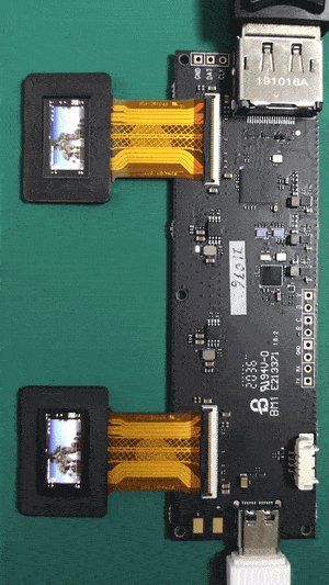 Dual 0.71-inch microdisplays connected to a controller board, playing a video demo.
