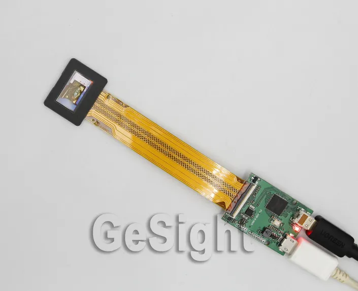 0.71-inch FHD Micro OLED display connected to a controller board demo kit with USB power.