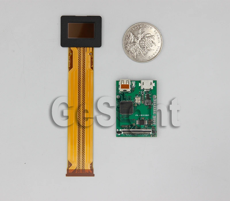 0.71-inch Micro OLED display module and controller board shown with a coin for size reference.