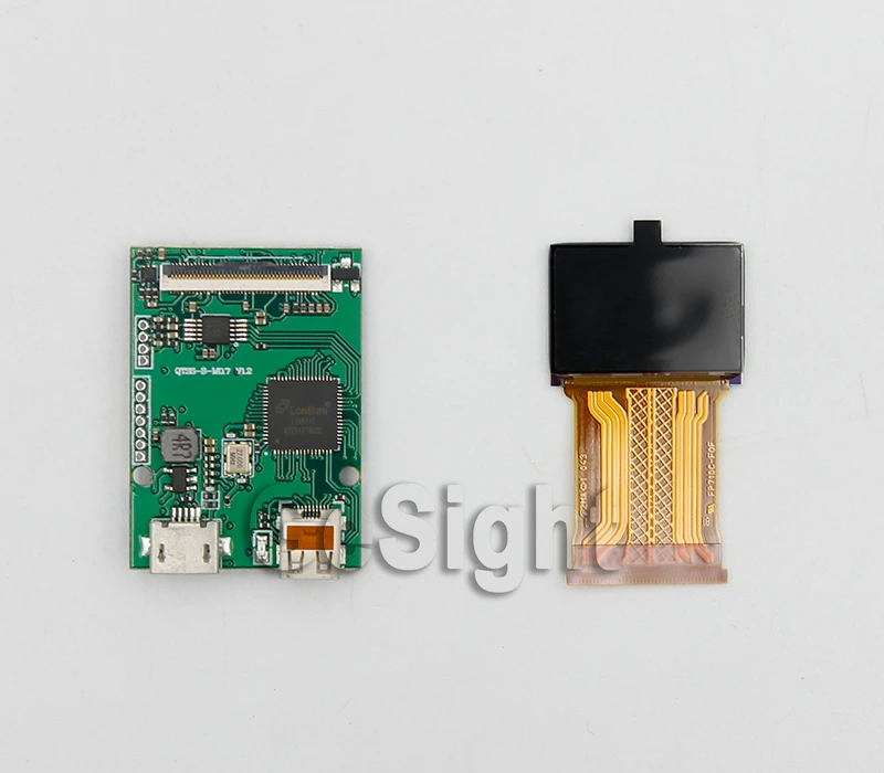 0.71-inch microdisplay placed next to a demo board for evaluation and testing.