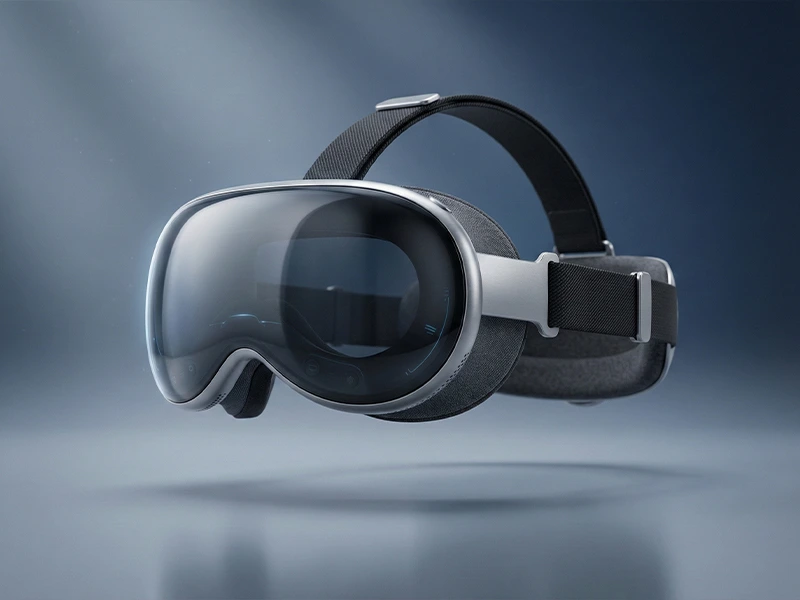 Vision Pro-style AR spatial computing headset floating in a clean studio scene with a glass visor and soft head strap.