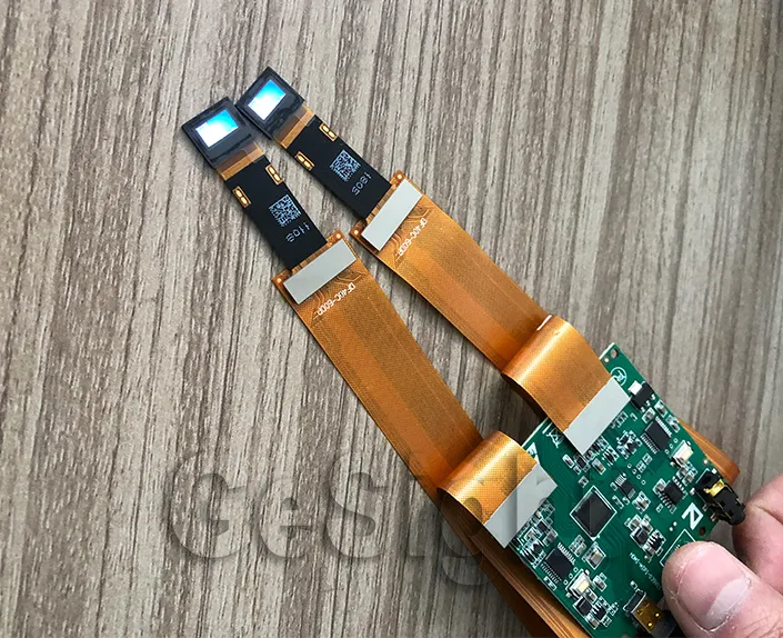 Dual 0.39-inch FHD Micro OLED modules connected to a demo controller board.