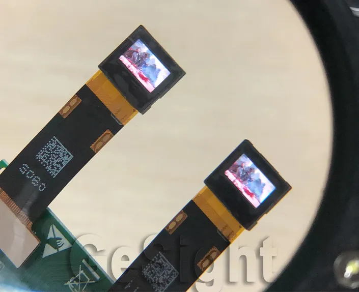 Close-up demo of two 0.39-inch FHD Micro OLED screens showing video content.