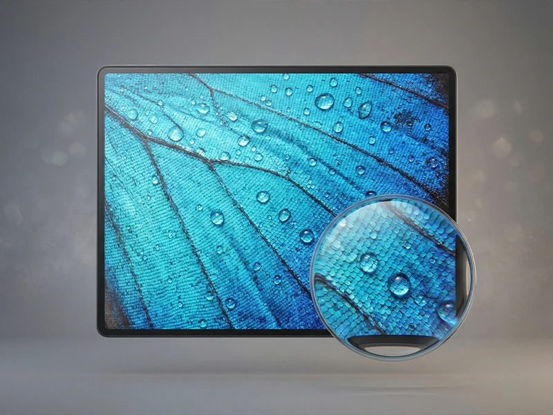High PPI display showing a butterfly wing macro with dew drops, featuring a magnifier that reveals ultra-fine scale detail.