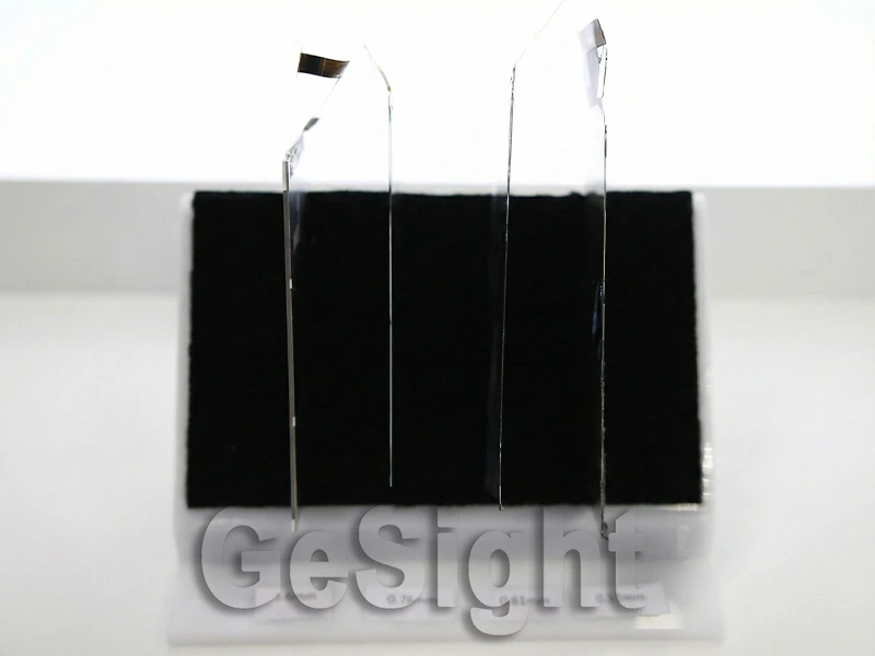 Ultra-thin display module edge profiles shown upright in a side-view comparison, emphasizing extremely thin construction.